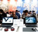 Visitors play the Final Fantasy XIV in the Square Enix Co. booth at Tokyo Game Show on September 17, 2016 in Chiba, Japan. Tokyo Game Show 2016 is held from September 15 to September 18, 2016.