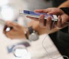 A visitor looks at an Xperia Z5 smartphone at the Sony stand at the 2015 IFA consumer electronics and appliances trade fair on September 4, 2015 in Berlin, Germany.