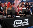 Eduardo Solorzano (2nd L) and George Ascencio (2nd R) play Ultra Street Fighter 4 against each other at the Asus computer booth during the TigerDirect Tech Bash.