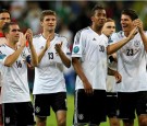 Germany's Philipp Lahm (L to R), Thomas Mueller, Jerome Boateng, and Mario Gomez celebrate a victory during their Euro 2012 quarter-final soccer match against Greece at the PGE Arena in Gdansk, June 22, 2012.