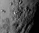 In this handout by NASA, a close-up image of a region near Pluto's equator shows a range of mountains rising as high as 11,000 feet (3,500 meters) taken by NASA's New Horizon.