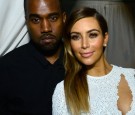 Kanye West (L) and Kim Kardashian attend DuJour Magazine's event to honor artist Marc Quinn at Delano South Beach Club on December 4, 2013 in Miami Beach, Florida.