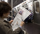  A woman reads about the royal wedding of TRH Prince William, Duke of Cambridge and Catherine, Duchess of Cambridge, in The New York Times newspaper