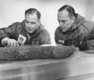 circa 1950: American army researchers, B L Hansen (left) and Dr Chester C Langway Jnr, at a laboratory in Hanover, New Hampshire, examining a core of gravelly soil drilled from one mile beneath the Greenland ice shee