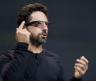 Sergey Brin, co-founder of Google Inc., wears Project Glass internet glasses while speaking at the Google I/O conference in San Francisco, California, U.S., on Wednesday, June 27, 2012. 