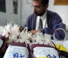 A Palestinian laboratory worker prepares blood units contributed by Palestinians at Shifa hospital in Gaza City in the Gaza Strip on March 18, 2003. 