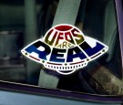 A sticker declares the existence of flying saucers from the window of a car parked on property near Jamul, CA, October 15, 2000.