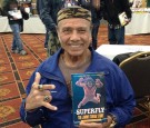 Superfly Jimmy Snuka shows off his autobiography!