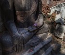 Debris is piled near a statue of Buddha on July 29, 2015 in Bhaktapur, Nepal. 