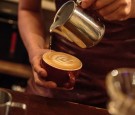 TOKYO, JAPAN - MAY 20: Barista Takaya Hashimoto prepares a cafe latte at a local specialty coffee shop on May 20, 2016 in Tokyo, Japan. With the rise of specialty coffee shops opening all over the world in recent years, Tokyo's coffee culture catches on t