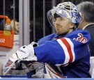 New York Rangers goaltender Lundqvist sits on the bench after being pulled from their NHL game against the Pittsburgh Penguins in New York