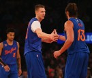 Kristaps Porzingis #6 of the New York Knicks celebrates a basket with teammate Joakim Noah #13 at Madison Square Garden on December 25, 2016 in New York City.