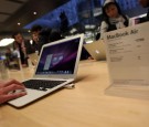 Customers at the midtown fifth avenue Apple Store look at the new MacBook Air on sale beginning today February 1, 2008 in New York City.