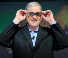 Samsung Electronics America's Vice President of Consumer Business Division John Revie wears new 3-D glasses that fit over regular glasses during a press event at the 2011 International CES.