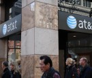 Pedestrians walk by an AT&T store on October 23, 2013 in San Francisco, California. AT&T is going to report third-quarter earnings after the closing bell.