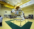 An Indian official stands beside The Franco-Indian Megha-Tropiques during a visit from French President Nicolas Sarkozy and First Lady Carla Bruni-Sarkozy at The Indian Space Research Organisation (IS