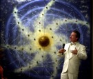 William Proctor stands next to a schematic of the 33 planets of the 'Interplanetary Confederation' as he addresses members of the Unarius Academy of Science at their headquarters in El Cajon, CA,