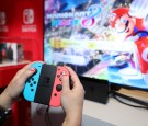 Nintendo of America, A guest enjoys playing Mario Kart 8 Deluxe on the groundbreaking new Nintendo Switch at a special preview event in New York on Jan. 13, 2017. 