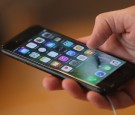 A visitor tries out an Apple iPhone 7 on the first day of sales of the new phone at the Berlin Apple store on September 16, 2016 in Berlin, Germany.