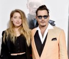 Actors Amber Heard (L) and Johnny Depp attend the 'Black Mass' Boston special screening at the Coolidge Corner Theatre on September 15, 2015 in Boston, Massachusetts.