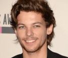 Singer Louis Tomlinson of One Direction, winners of the Favorite Pop/Rock Album for 'Take Me Home,' poses in the press room during the 2013 American Music Awards at Nokia Theatre L.A