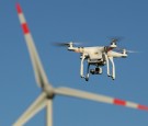 The photographer's DJI Phantom 3 Pro multirotor drone flies near a wind farm on June 8, 2016 near Brueck, Germany.