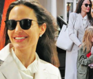 Angelina Jolie beams as she stuns in an all white ensemble while enjoying a day out in London with her kids