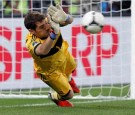 Spain's goalkeeper Iker Casillas makes a save against Portugal's Joao Moutinho during penalty shoot-out of the Euro 2012 semi-final soccer match against Portugal at Donbass Arena in Donetsk, June 27, 2012.