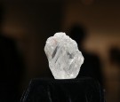 The 1109-carat rough Lesedi La Rona diamond, the biggest rough diamond discovered in more than a century, sits in a display case at Sotheby's on May 4, 2016 in New York City. The stone was found by Lucara Diamond Corp. last year at its Karowe mine in Bots