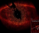  UNDATED: In this handout provided by NASA, a visible-light image from the Hubble Space Telescope shows a red ring of dust and debris that surrounds the star Fomalhaut and the newly discovered planet, Fomalhaut b, orbiting its parent star