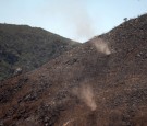 MAY 16: Dust devils lift ash and dirt from a burned hillside at the Cocos fire on May 16, 2014 in San Marcos, California. The fire continues to threaten communities with little containment three days after nine wildfires broke out in a single day in San D