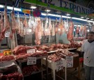 A butcher stands in front of his shop at an almost empty Varvakios meat market on February 20, 2017 in Athens Greece. 