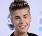 Singer Justin Bieber attends the 40th American Music Awards held at Nokia Theatre L.A. Live 