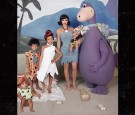 Kanye West's Halloween costume scares her 1-year-old daughter Chicago in his Dino costume from the most animated show in 60's, The Flinstone.