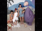 Kanye West's Halloween costume scares her 1-year-old daughter Chicago in his Dino costume from the most animated show in 60's, The Flinstone.
