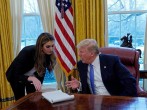 Hope Hicks speaking with President Donald Trump