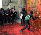 Mexican demonstrators marched toward the Mexican Palace where President Obrador and his family lives and painted re the palace large and ornate door.