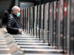 Man in a face mask is seen at the Cadorna railway station in Milan