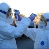 Medical staff use thermometers during checks for coronavirus at the border crossing with Italy in Vrtojba, Slovenia.
