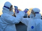 Medical staff use thermometers during checks for coronavirus at the border crossing with Italy in Vrtojba, Slovenia.