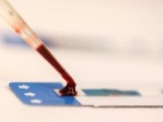 A nurse tests a blood sample during a free HIV test at a blood tests party