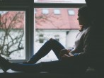 girl sitting by the window