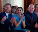 Britain's Prince Harry and his wife Meghan, Duchess of Sussex, sitting next to Ross Kemp, cheer during the annual Endeavour Fund Awards at Mansion House in London. 