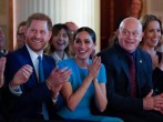 Britain's Prince Harry and his wife Meghan, Duchess of Sussex, sitting next to Ross Kemp, cheer during the annual Endeavour Fund Awards at Mansion House in London. 