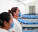 FILE PHOTO: Two nurses wearing protective masks pose inside the new immediate response mobile hospital in Pachuca