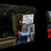 A street vendor sells protective plastic face shields against the coronavirus disease (COVID-19) as the outbreak continues, in Mexico City