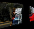 A street vendor sells protective plastic face shields against the coronavirus disease (COVID-19) as the outbreak continues, in Mexico City