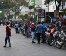 Motorcycle drivers wait in line to the opening of a gas station during a nationwide quarantine due to coronavirus disease (COVID-19) outbreak in Caracas, Venezuela.