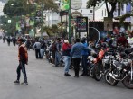 Motorcycle drivers wait in line to the opening of a gas station during a nationwide quarantine due to coronavirus disease (COVID-19) outbreak in Caracas, Venezuela.