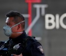 A police officer wearing a protective mask stands at the entrance of a coronavirus testing site, as the coronavirus disease (COVID 19) continues in Mexico City